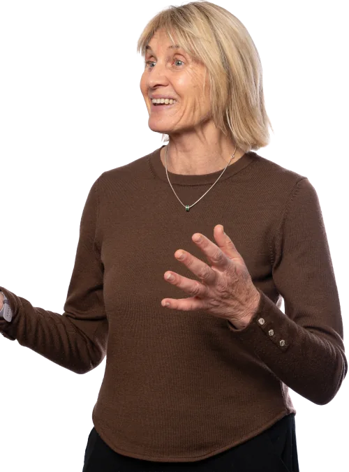 Catherine Syme, public speaking coach, wearing a brown top presenting a workshop.